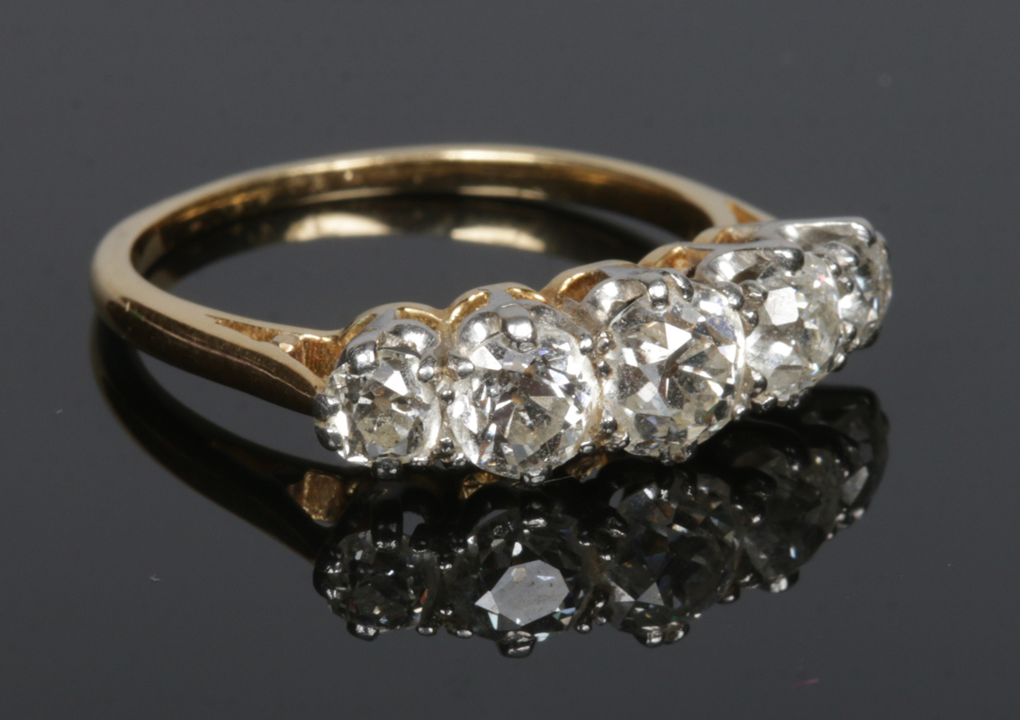 An 18 carat gold five stone diamond ring - Paul Beighton Auctioneers